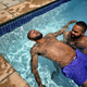 Brendan Smith teaches his partner, Tyrice Hester, how to float, Toronto 2016. (Zun Lee via New York Times)